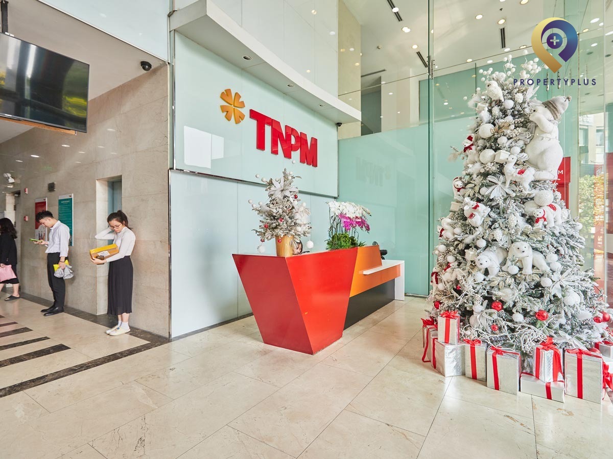 Reception area at Sky City Towers with modern red desk and Christmas decorations - hình ảnh từ Property Plus